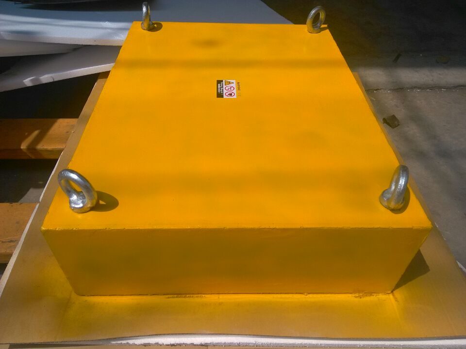 Yellow suspended plate magnet with four eyebolts for hanging above a conveyor